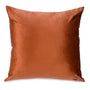 Rust-colored velvet cushion